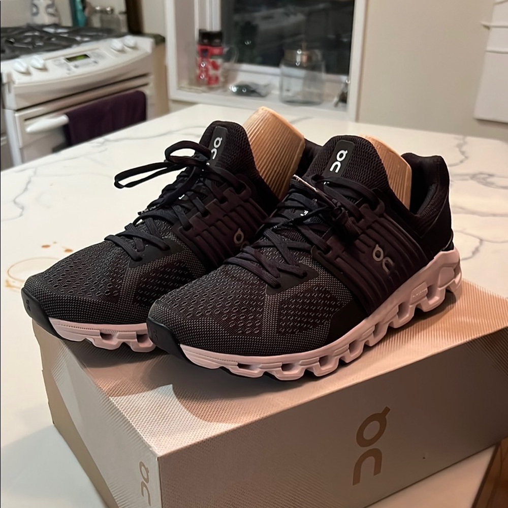 On Running Black and White Athletic Shoes with Cloud Cushioning